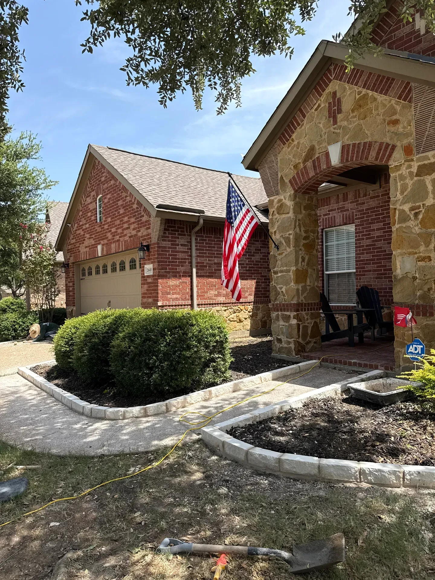 stone edging beside front entry walkway