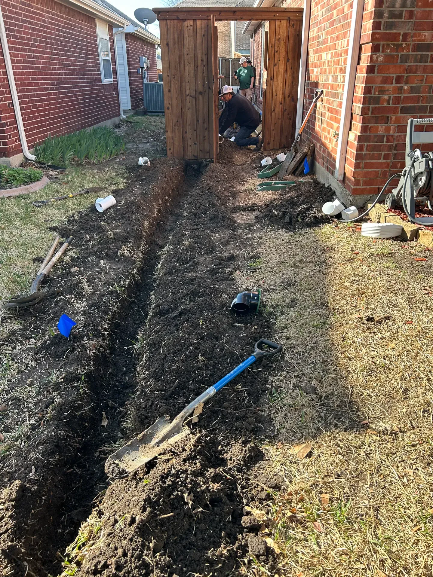 open drainage trench through side yard gate