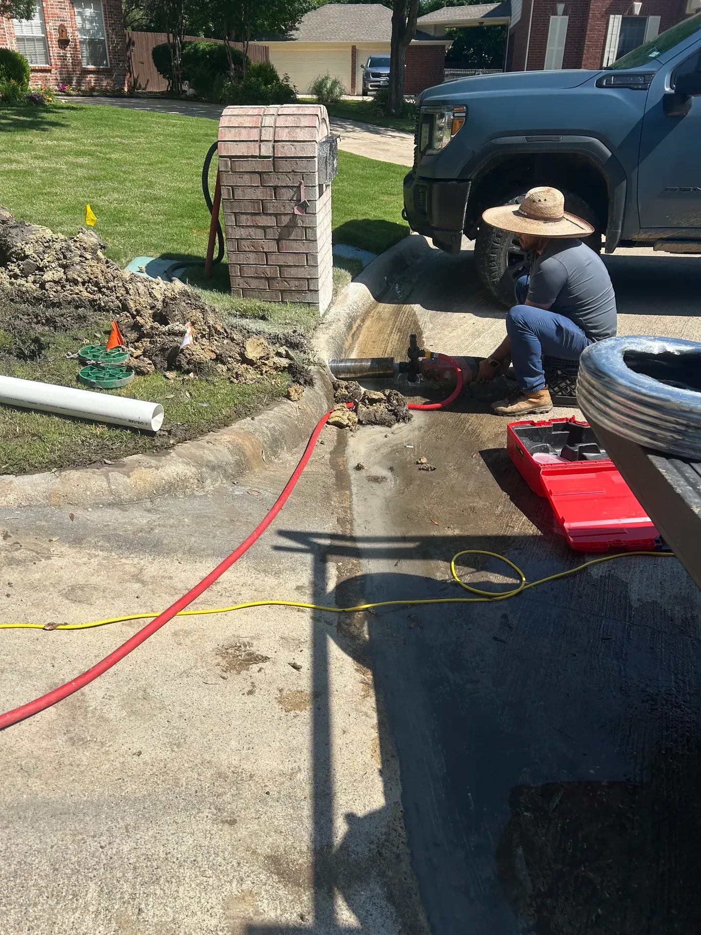 crew preparing curb outlet