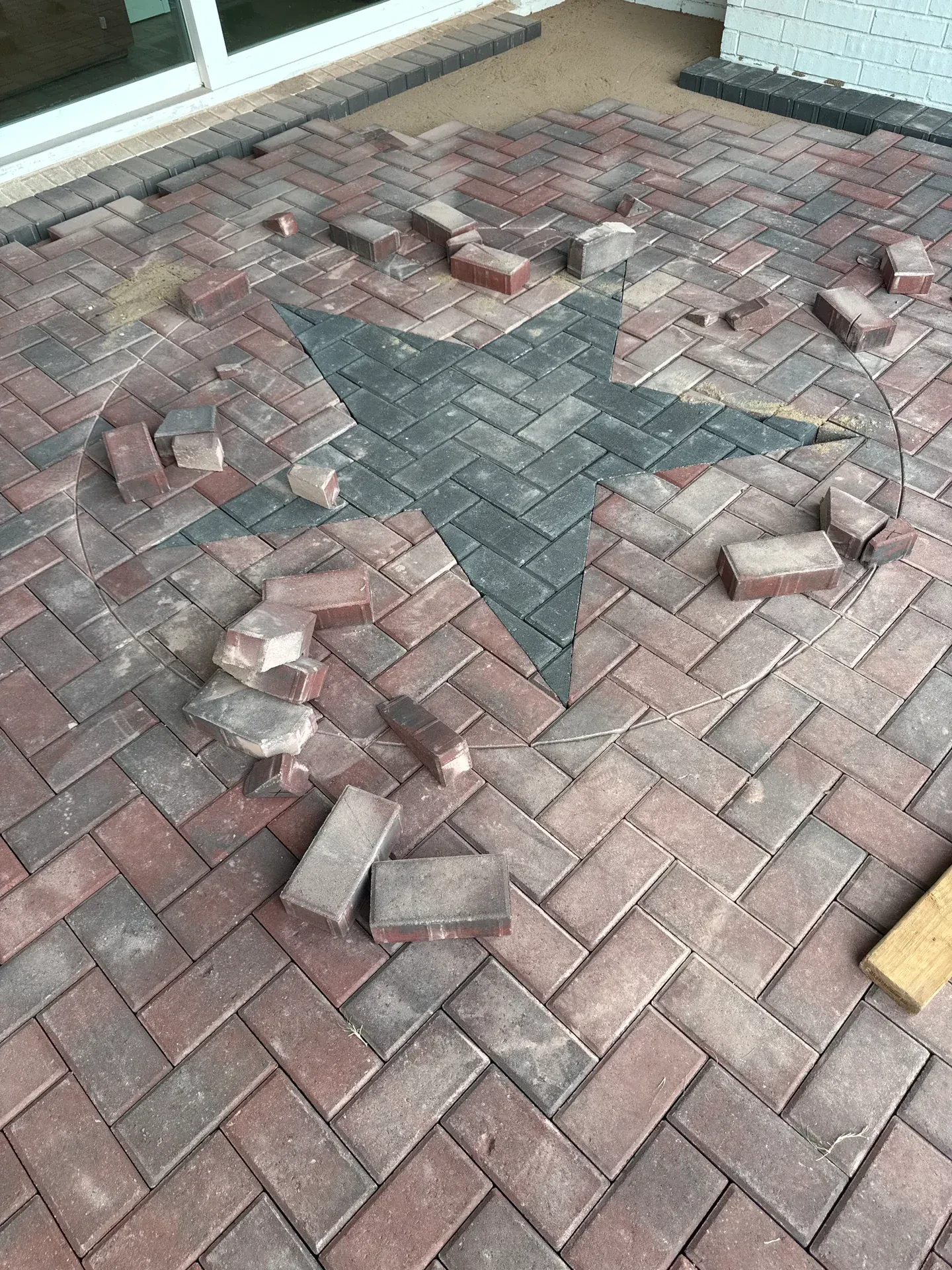 star inlay paver patio during installation