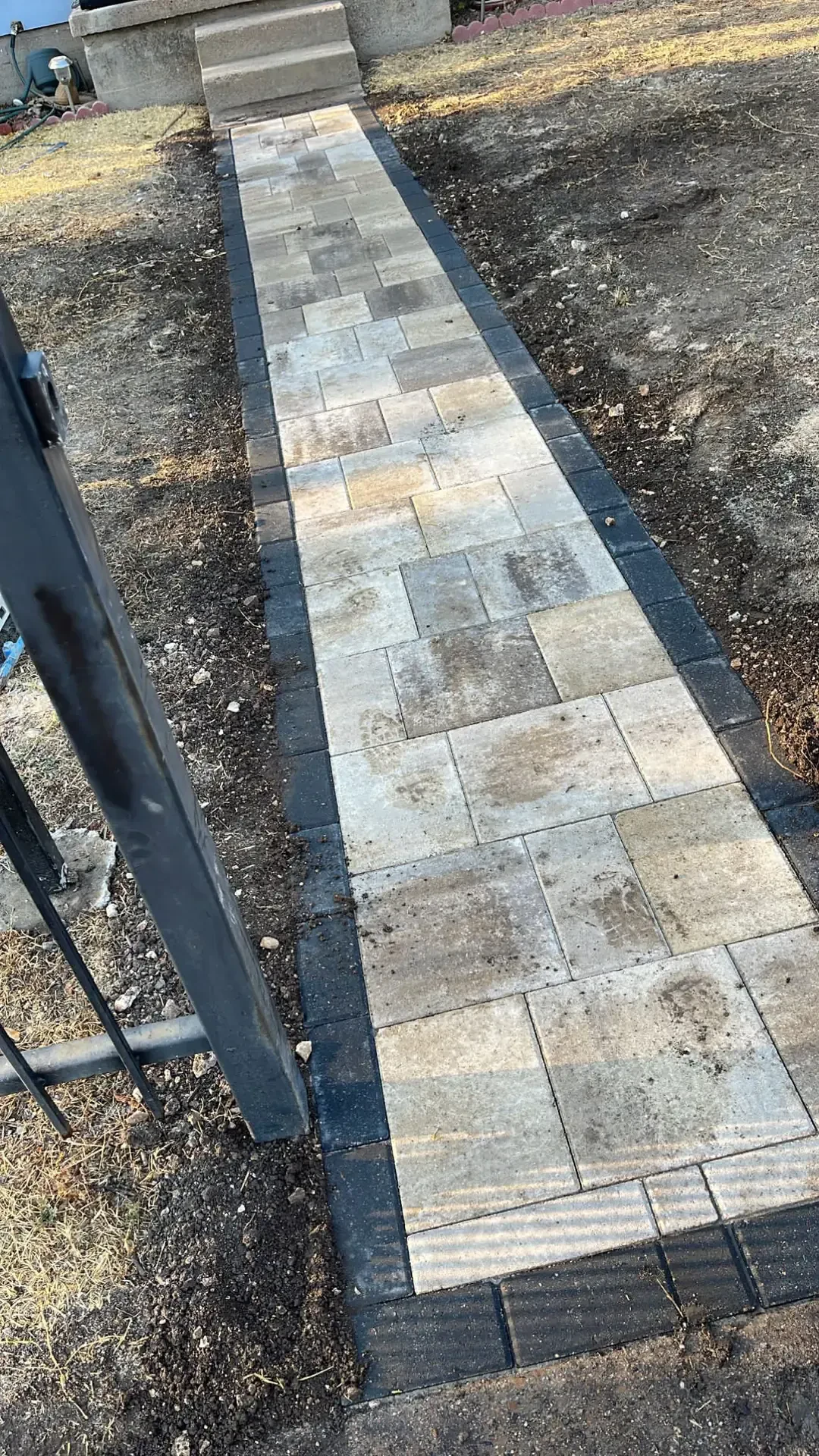 finished paver walkway with charcoal border
