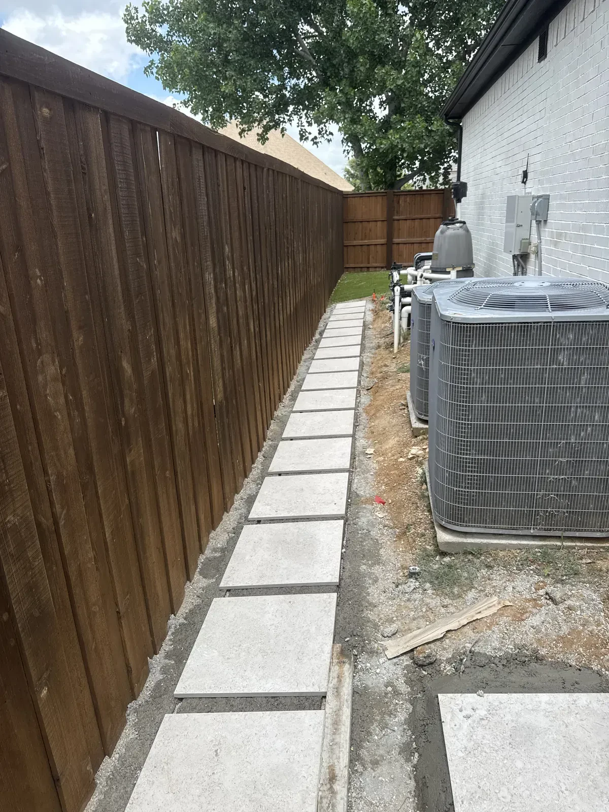 Side yard stepping stones before gravel fill