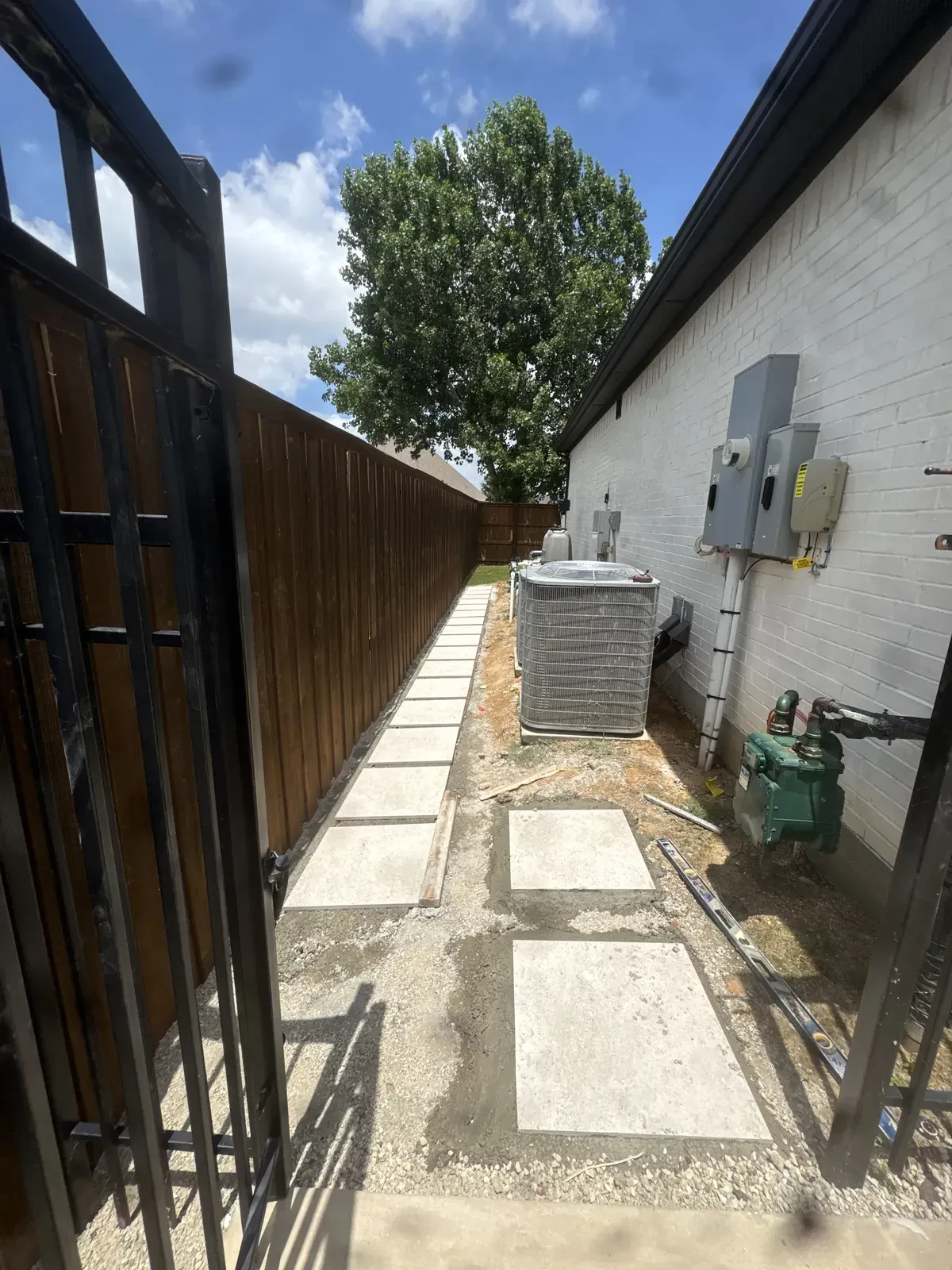Stepping stone layout beside utility equipment