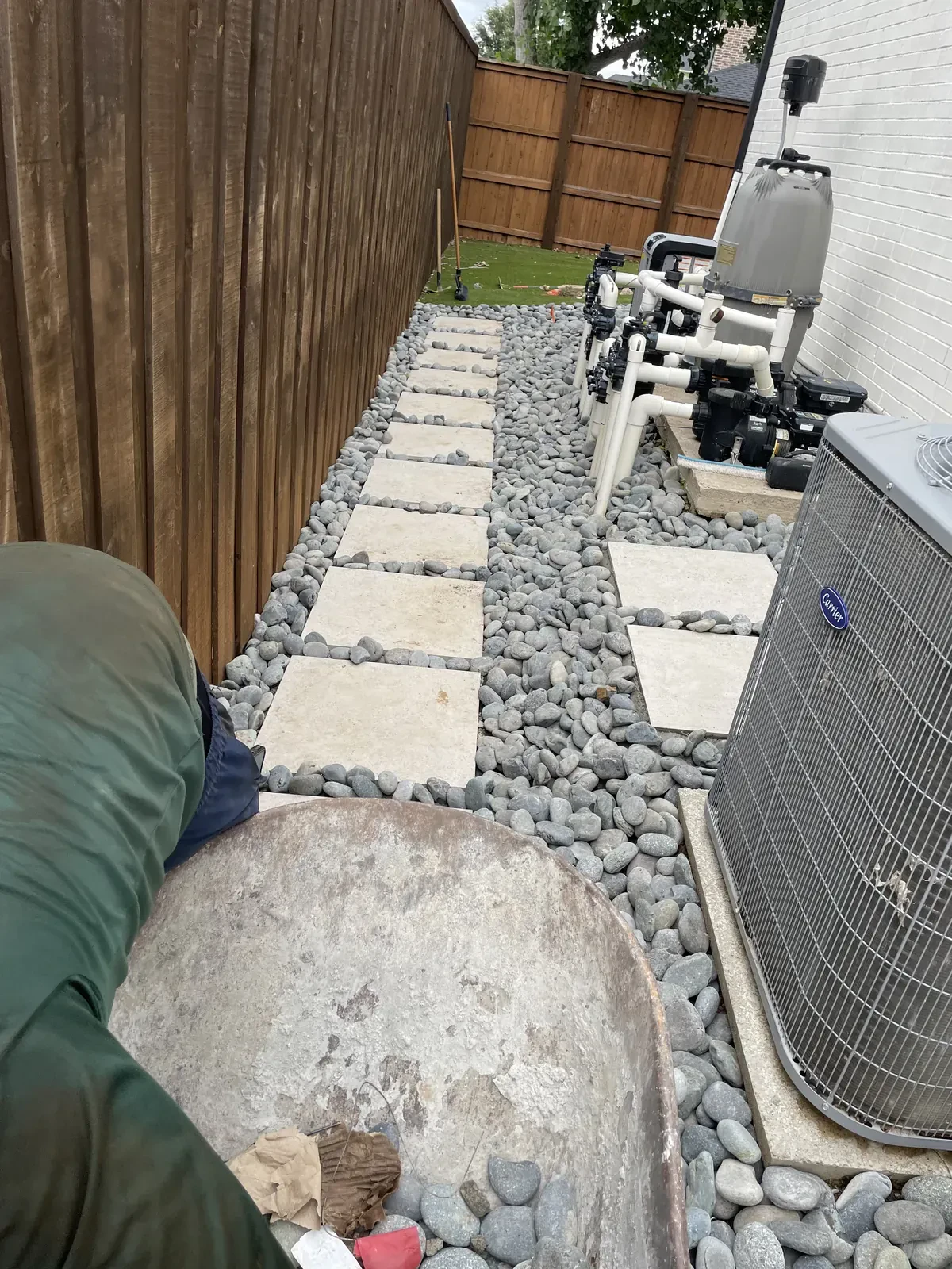 River rock walkway around utility equipment