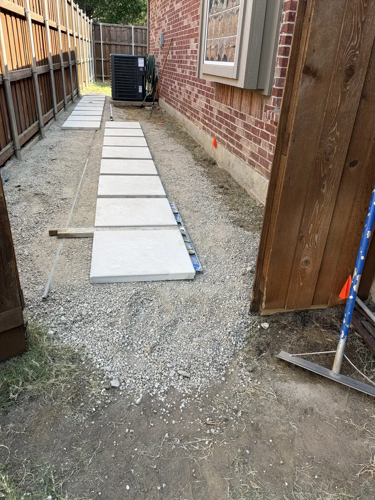 Long stepping stone walkway on prepared base